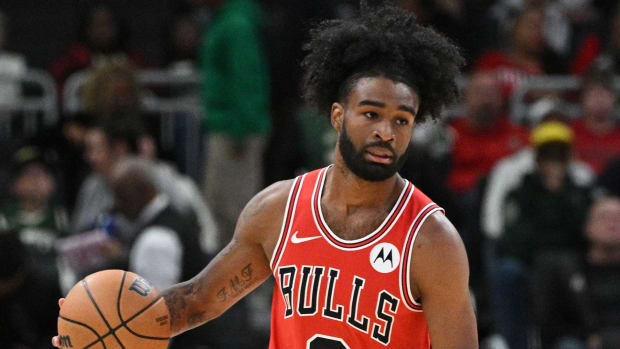 Chicago Bulls guard Coby White (0) brings the ball up the court against the Milwaukee Bucks in the first half at Fiserv Forum